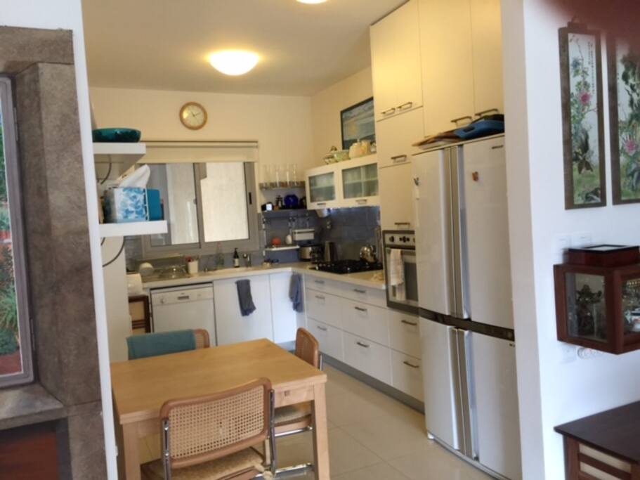 Breezy modern kitchen and breakfast table.