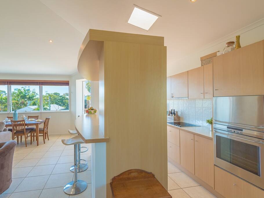Looking from the fridge through the kitchen.