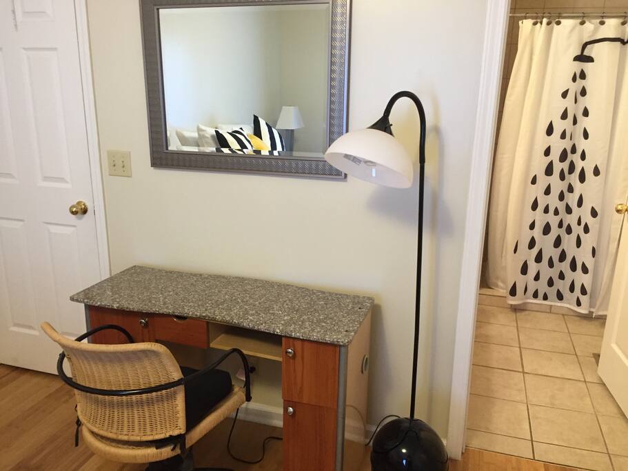 Desk and bathroom in master suite