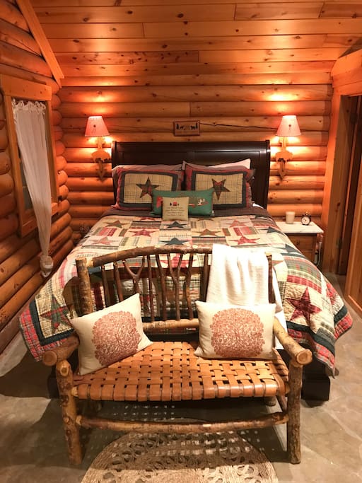 Queen bed with extremely comfortable mattress. Antique leather and wood bench.