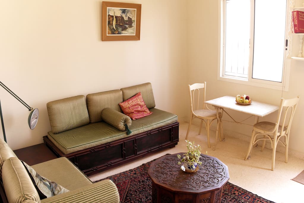 The bright living room with vintage furniture