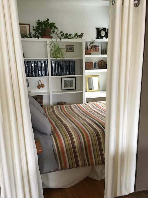 Downstairs queen bedroom with privacy curtains
