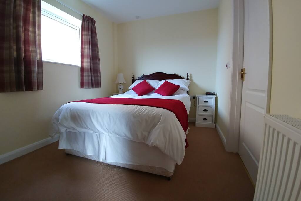 Double bed with flat screen TV.