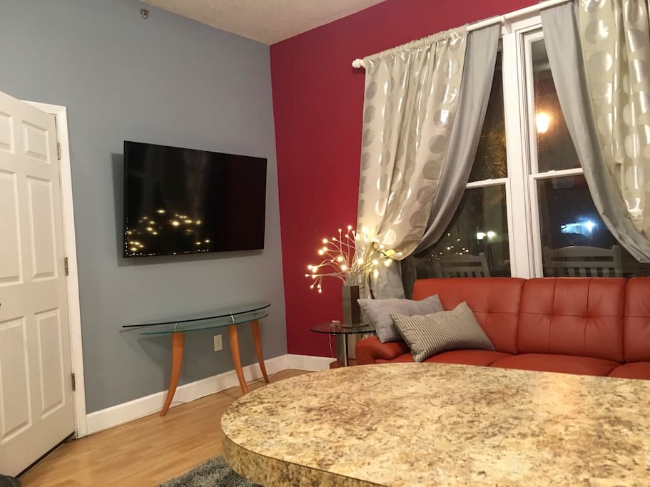 Italian leather sectional couch to accomadate one additional adult or two children. 60" mounted HDTV with cable and upgraded channel listings.