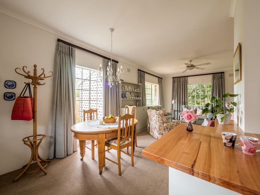 Bright and fresh open plan living with a dining table in the spacious living area.