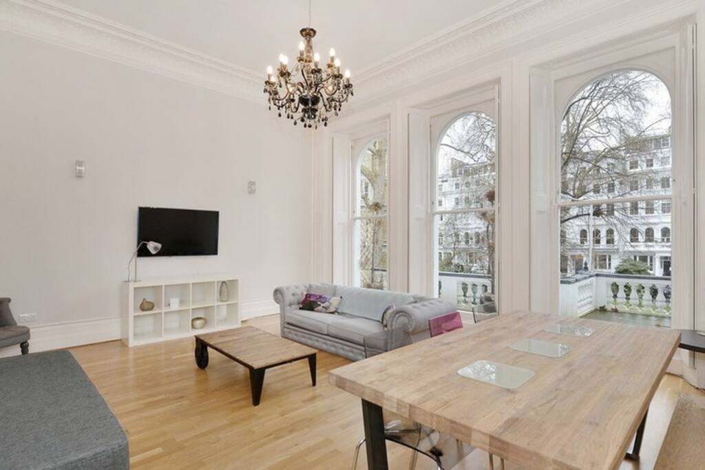 Living Room with terrace to the front, wifi, king size sofa bed, large dining table and chairs.