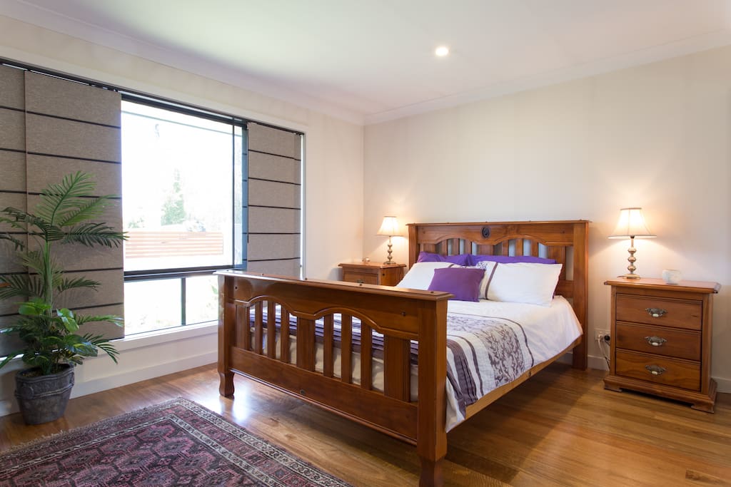 This is the guests queens sized bed which overlooks garden. There are security screens which allows our guests to have the window open if desired