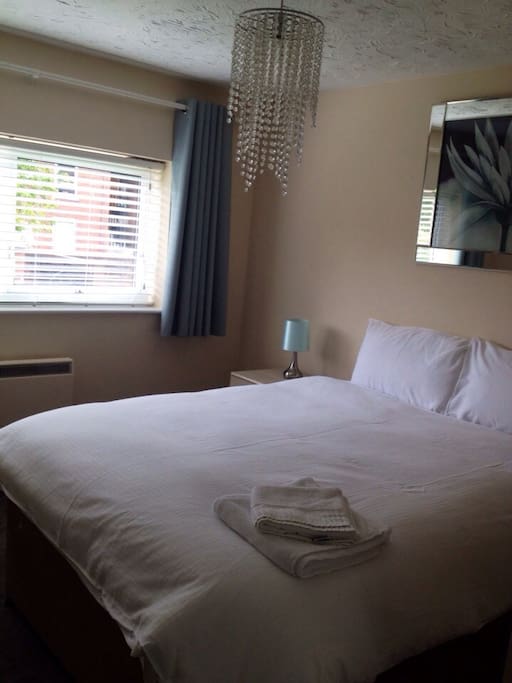 Bedroom 1
With blackout curtains, wardrobe and bedside tables.