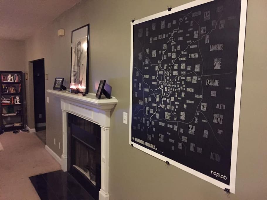 This is the living room with a gas fireplace a map of Indy, my Prince shrine on the mantel and my personal library.