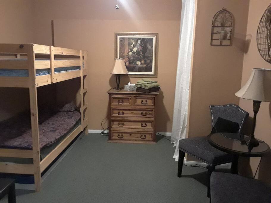 The bedroom has bunkbeds for two and we have a floor mattress for a third person. We even have a double air mattress to accommodate 2 people so four people could sleep in the room but it would be tight.