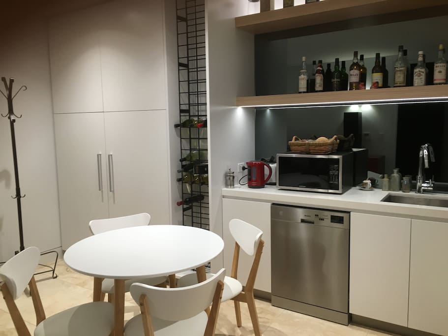 Own kitchen with Miele electric cooktop, microwave, fridge & freezer, table & chairs for 4