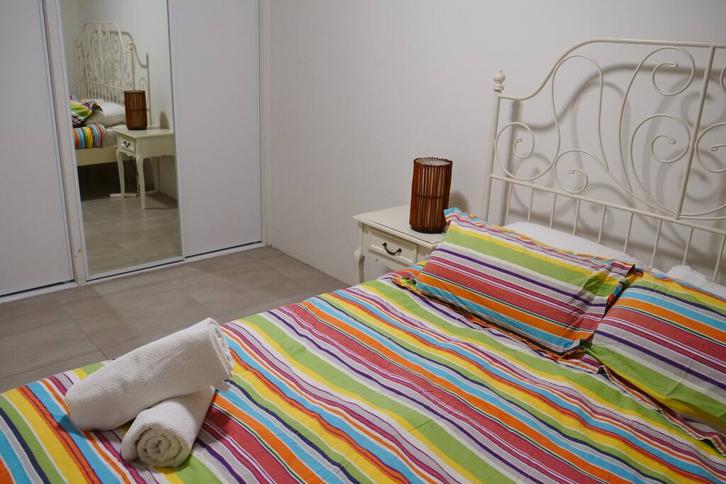 The private queen room with a built in wardrobe and floor length mirror