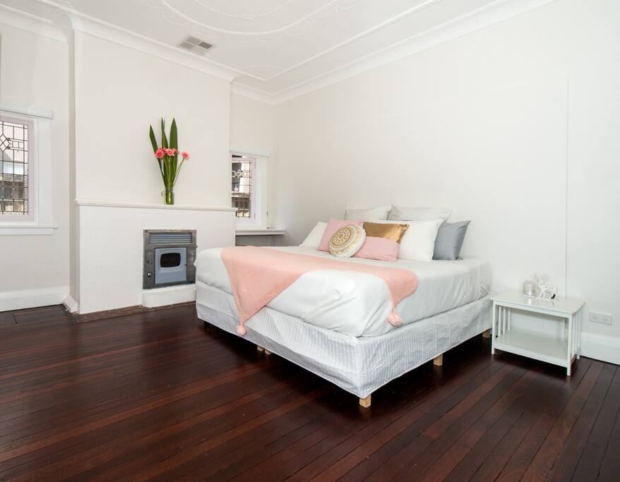 Large bedroom with stain glass windows