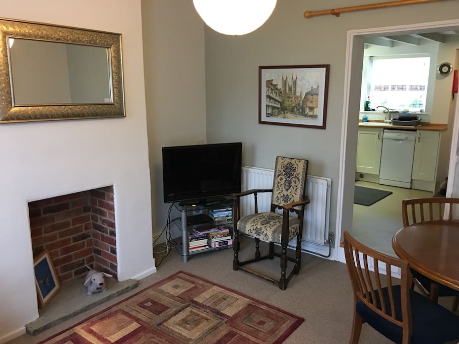 Living/Dining room with TV & DVD player.