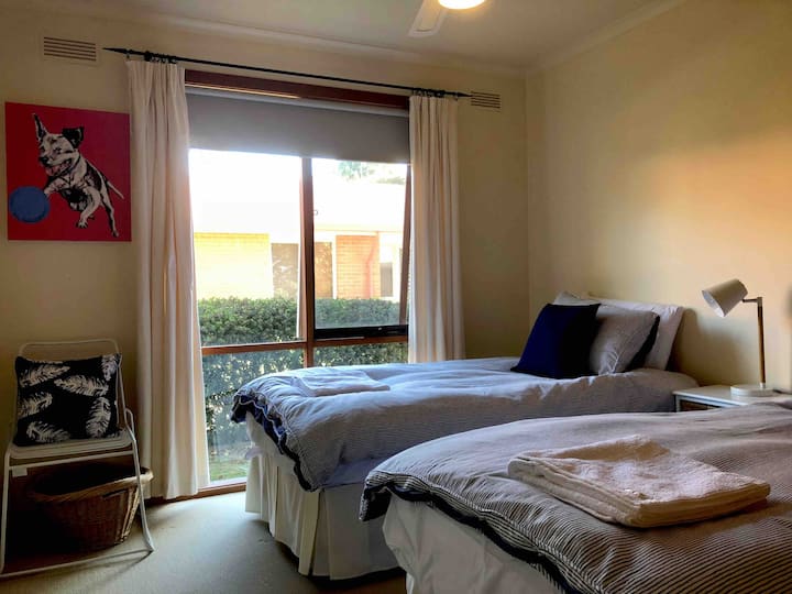 Second bedroom with two single beds. Trundle available on request. The painting is an original by Colin - we hope you like it!