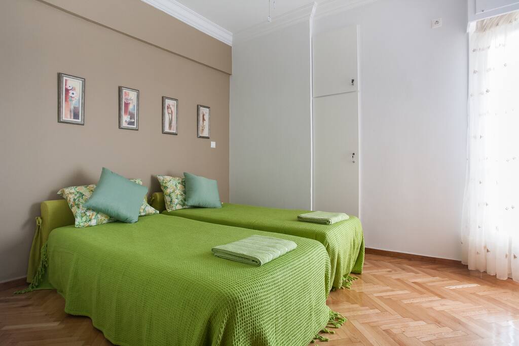 A bright and spacious bedroom with two twin beds