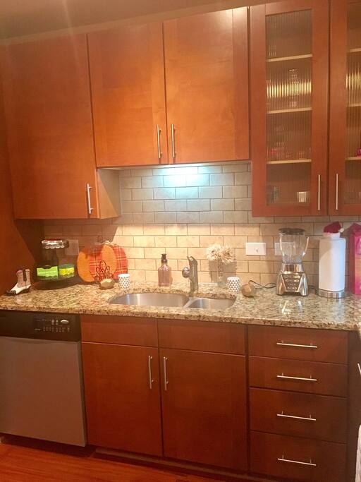 Full kitchen with amenities provided.