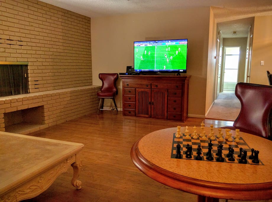 Living room has a 55 inch smart TV.