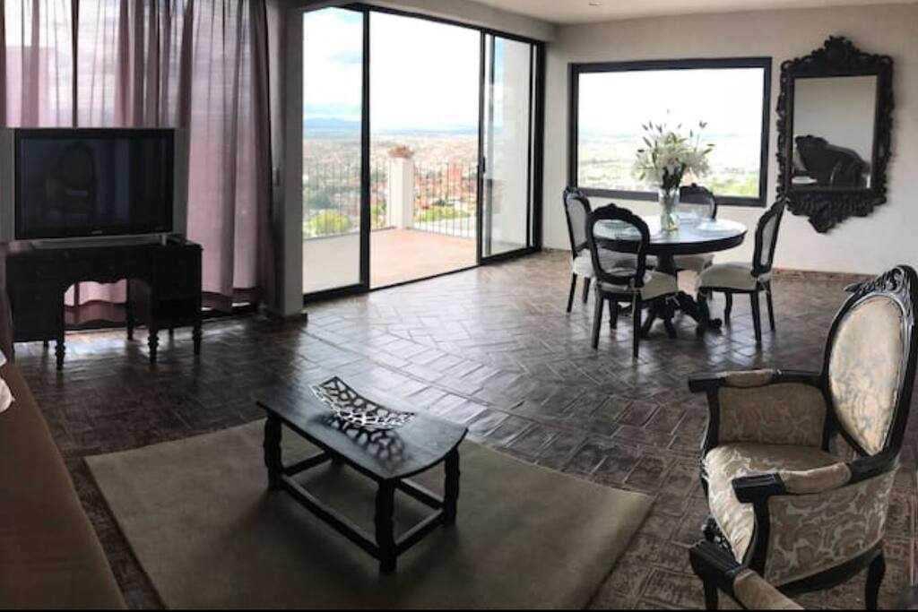 Open lounge and dining area with views of city below...