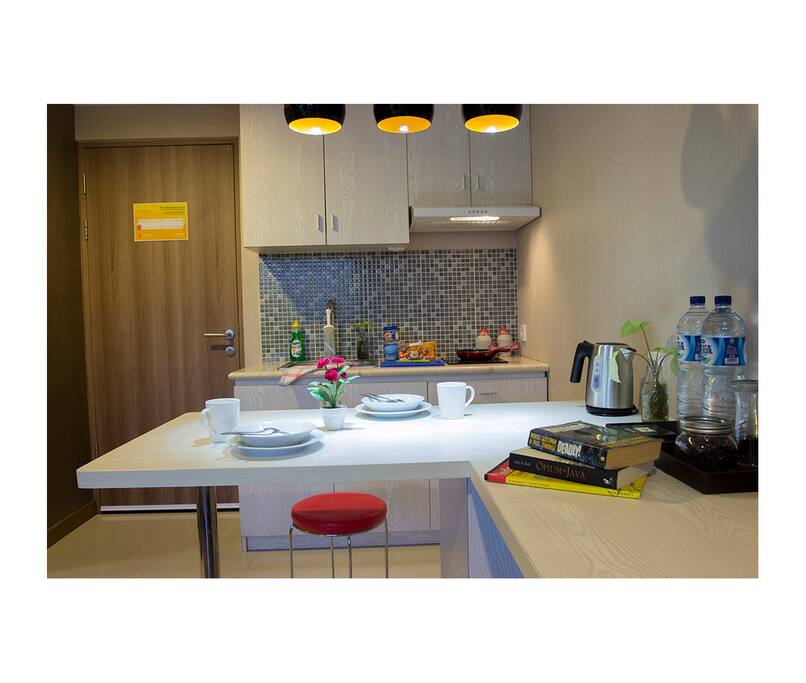 Cozy kitchen with electric stove & water kettle