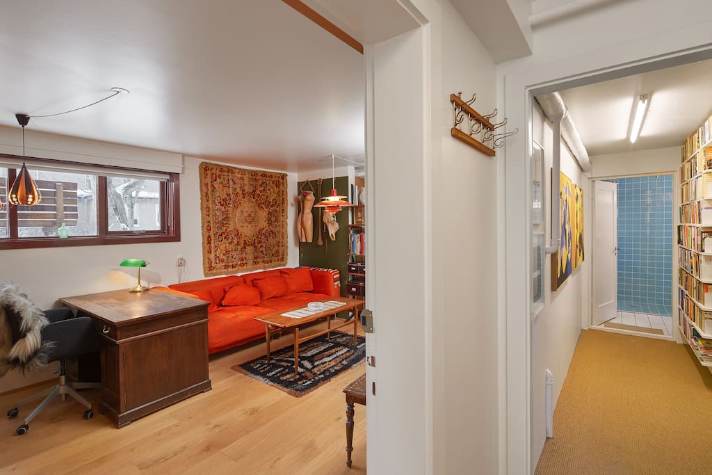View from the corridor, living room to the left, hallway to the right