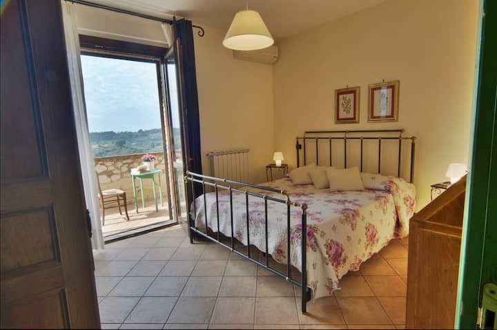 The double bedroom with terrace on the first floor