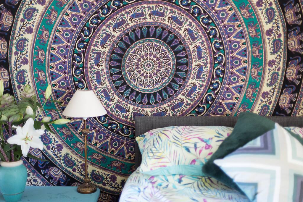 The bed, it's a very comfortable and colourful space.
