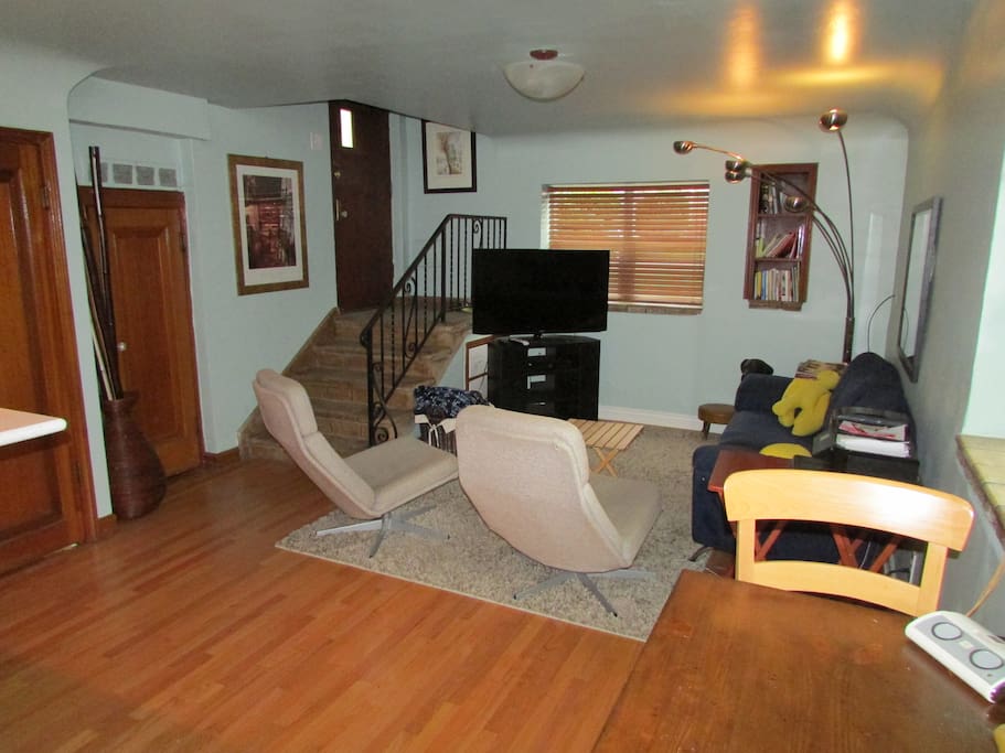 Table for two, entry and living area.