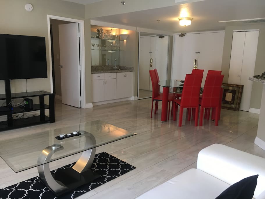 spacious living room with a big smart TV.