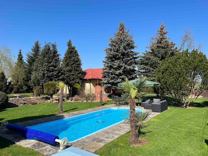 Poolside home with a large garden