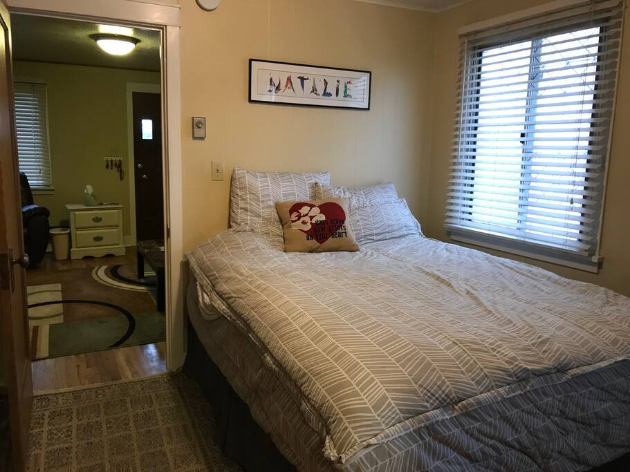 Larger bedroom with queen size bed