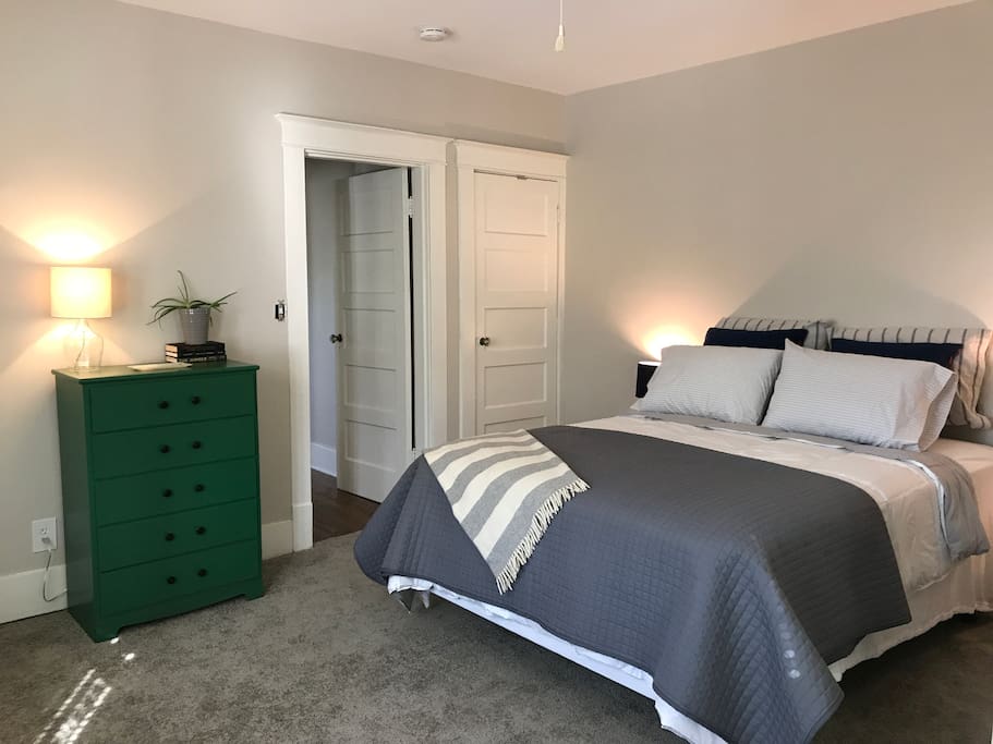 Cozy, light-filled bedroom with brand new Sealy Posturepedic mattress.