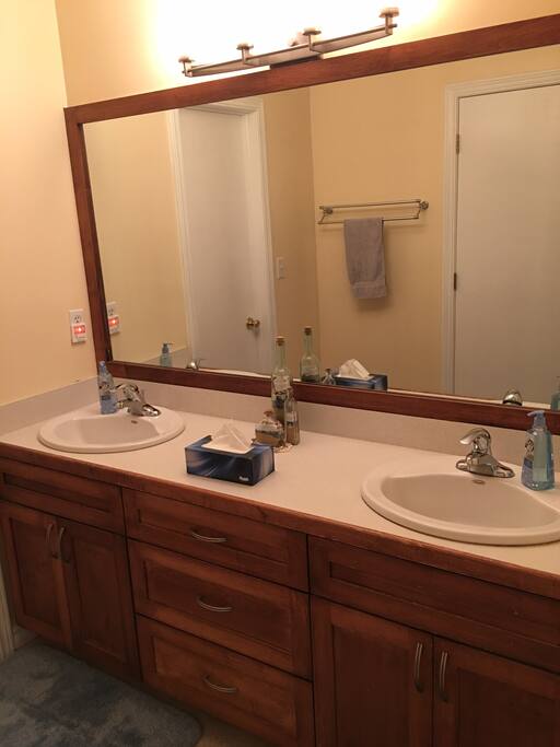 His & hers sinks in the attached bathroom
