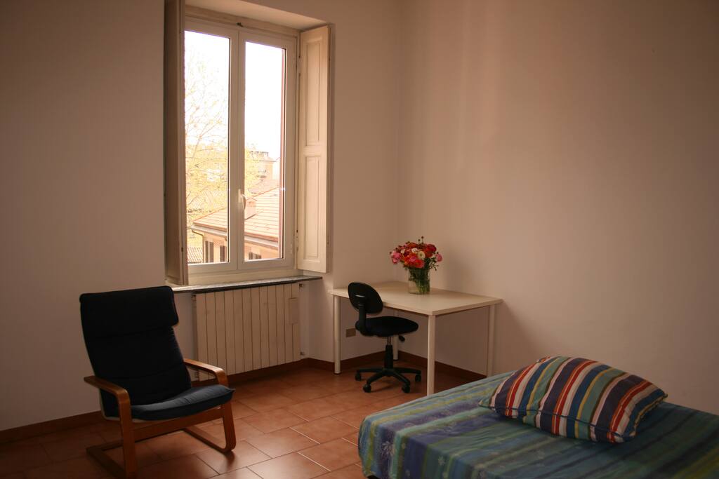 Bedroom with window looking on the internal courtyard