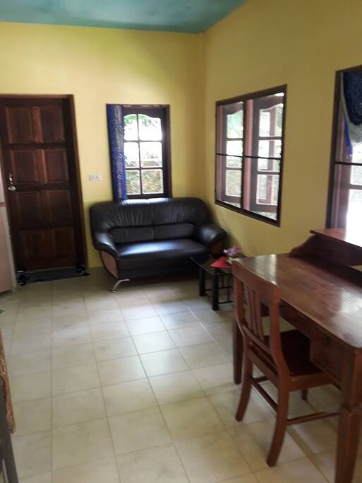 living room with big fridge and freezer