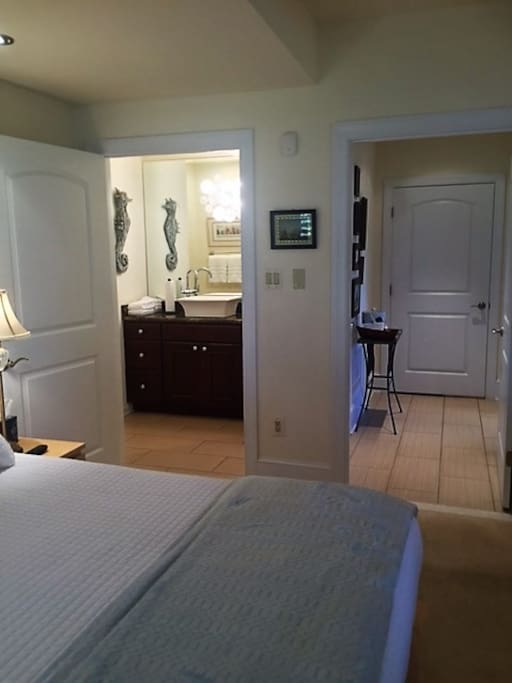Ensuite bath off of bedroom; hallway to sittingroom
Bath is accessible from hallway as well.