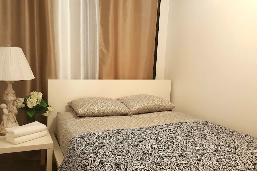 This is exactly how you will find your bedroom upon checking in. Sheets, blanket and towels are provided. Mattress is GREEN TEA MEMORY FOAM. There is a full sized mirror in your room!
