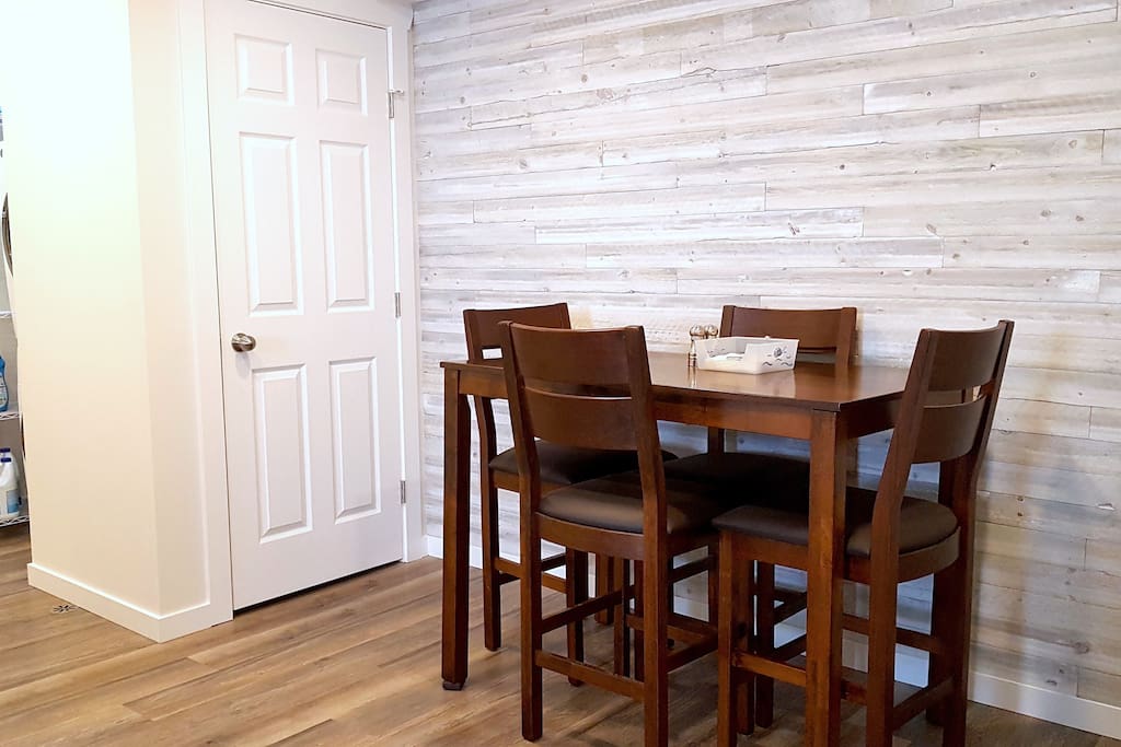 Dining/work area with shiplap feature wall