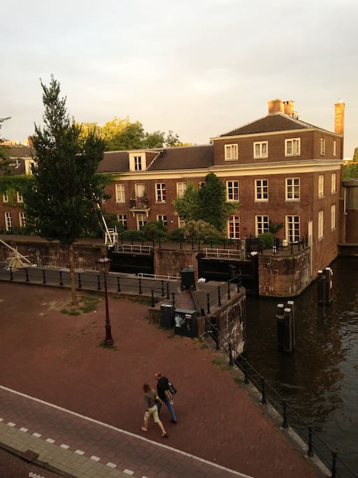 view at the entrance of the monumental Scharrebiersluis that connects the Nieuwe Herengracht with Oosterdok