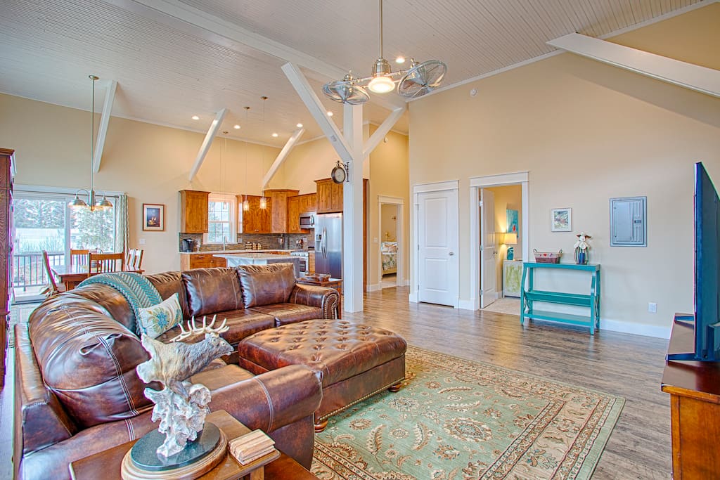 Open concept with 14' ceilings and original beams.