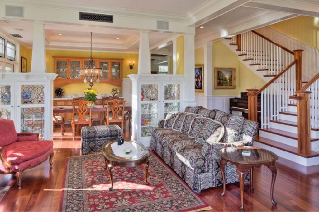 Living Room, formal dining room and stairs to second floor