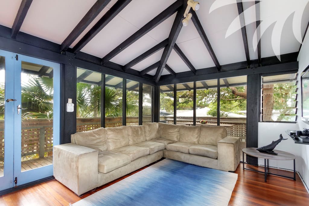 Tree Tops Wall mounted TV and access to deck