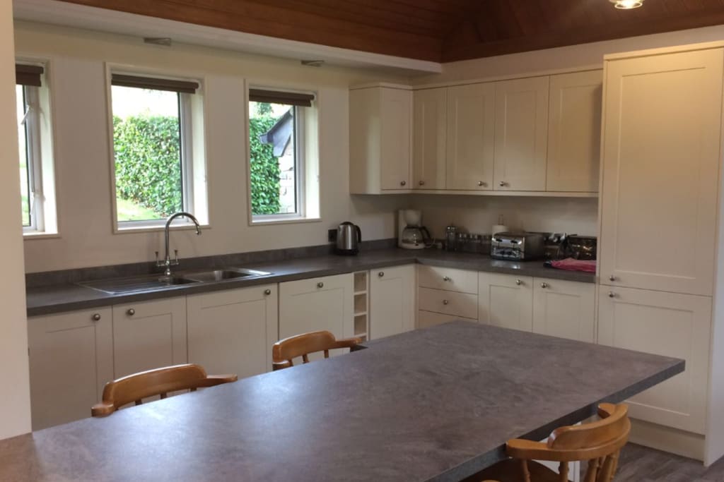 Kitchen with views to countryside. Fridge Freezer, Microwave, Oven, etc.