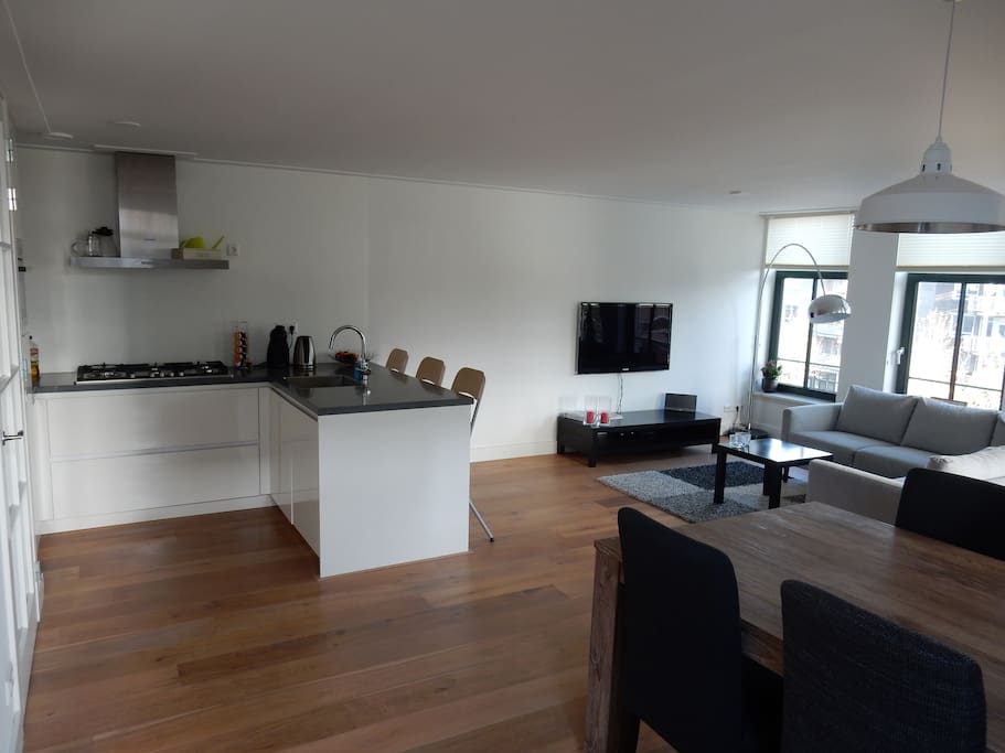 Living room, open kitchen, 42 inch flat screen tv