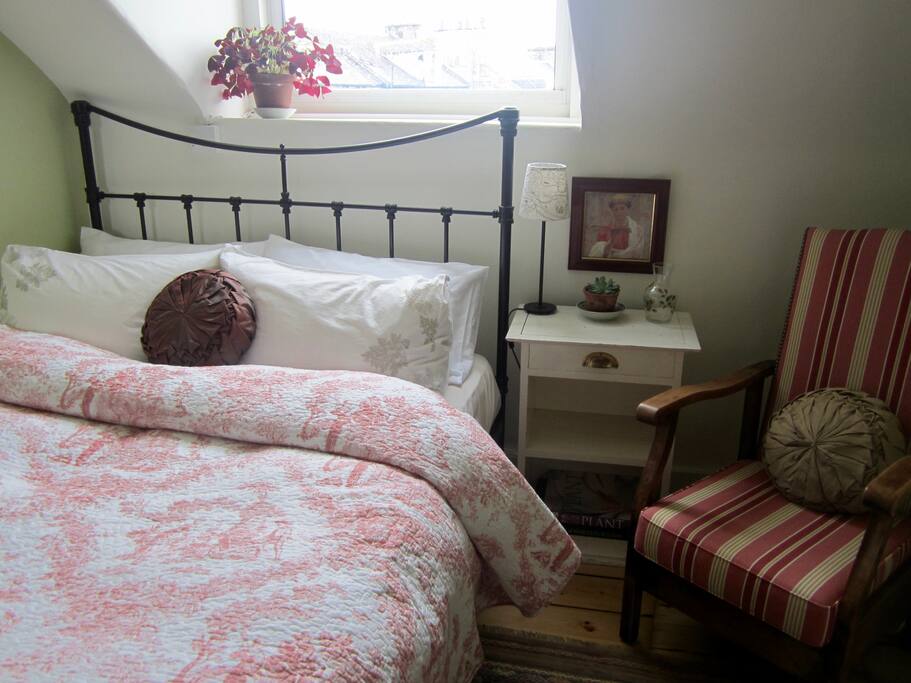 Bed made with high quality cotton sheets & feather duvet & pillows