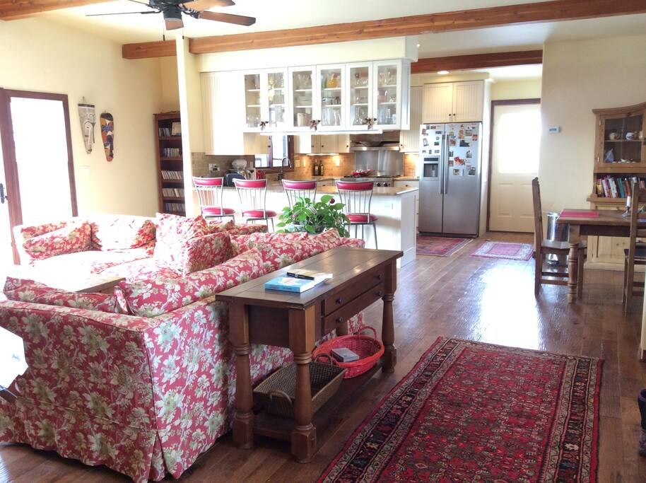 Upstairs Living Room with wood-burning fireplace and Kitchen and Dining Area