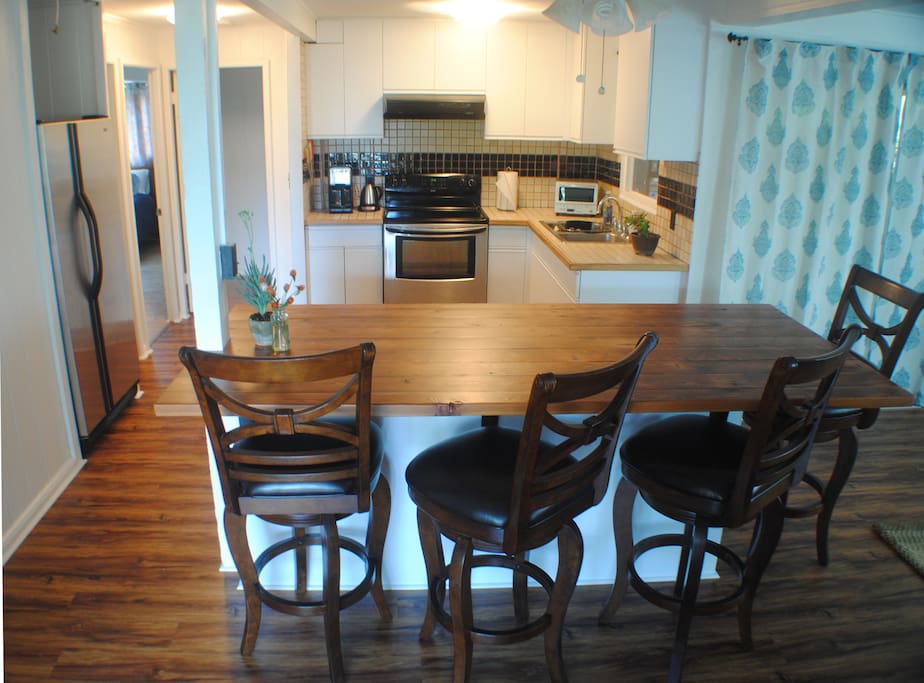 Kitchen and island stocked with all the amenities