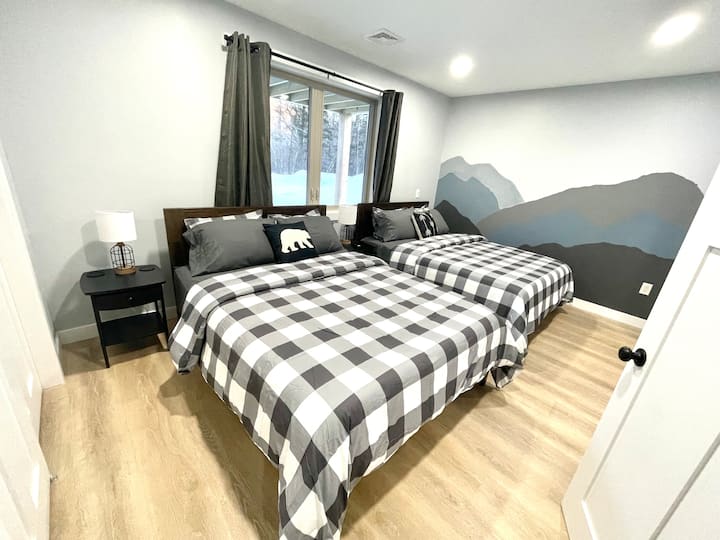 The 4th bedroom is in the lower level and features 2 queen beds.
