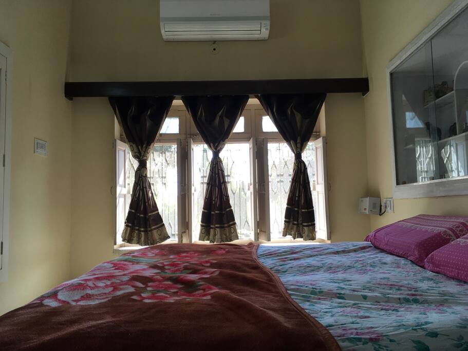 Chip: A relaxing cream color painted room comes with AC newly fitted AC not notch O'General Air conditioner. This room sports a huge entire wall set window with a beautiful garden view. The room also has mat white colored royal wooden word.
