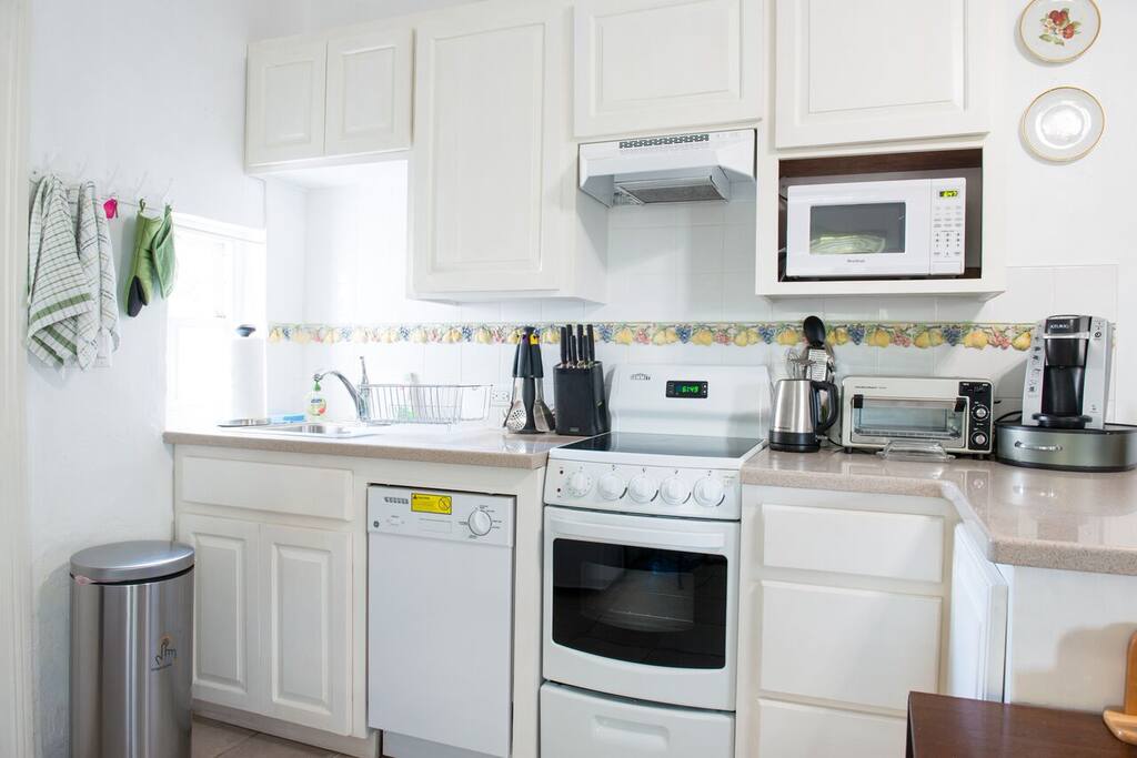 Fully stocked kitchen with the conveniences that you need, including a stove/oven, dishwasher and all utensils